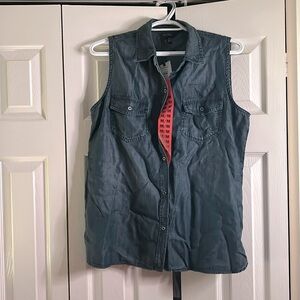 Never worn button down material women’s shirt, has the look of a denim.